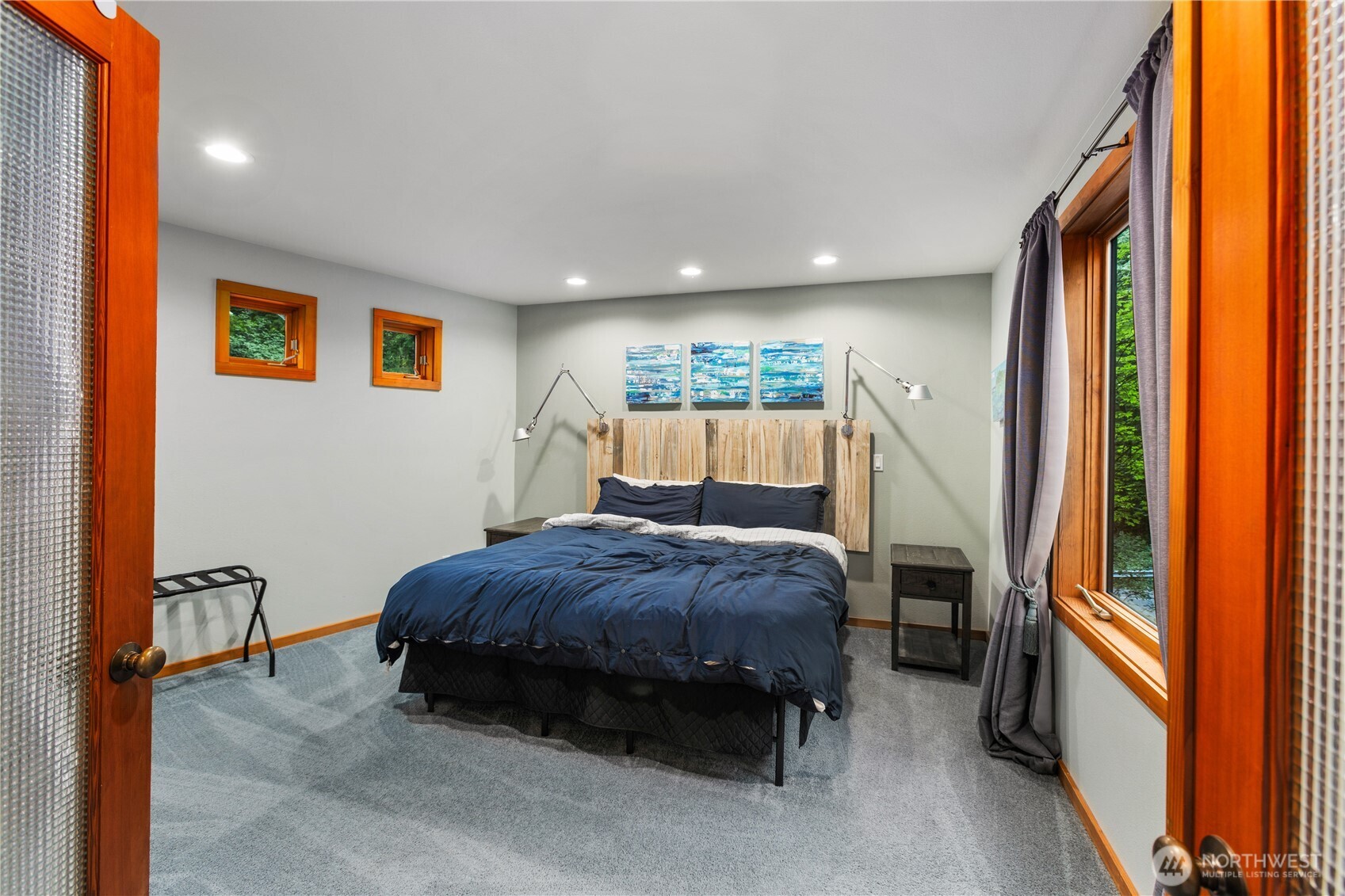 6520 East Mercer Way Mercer Island, WA 98040 - Photo 25 of 36 a bedroom with a bed and a large window