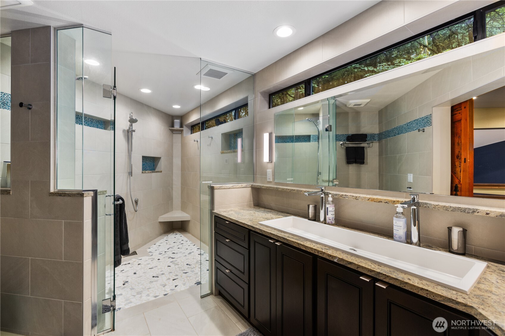 6520 East Mercer Way Mercer Island, WA 98040 - Photo 28 of 36 a bathroom with a sink double vanity and a shower