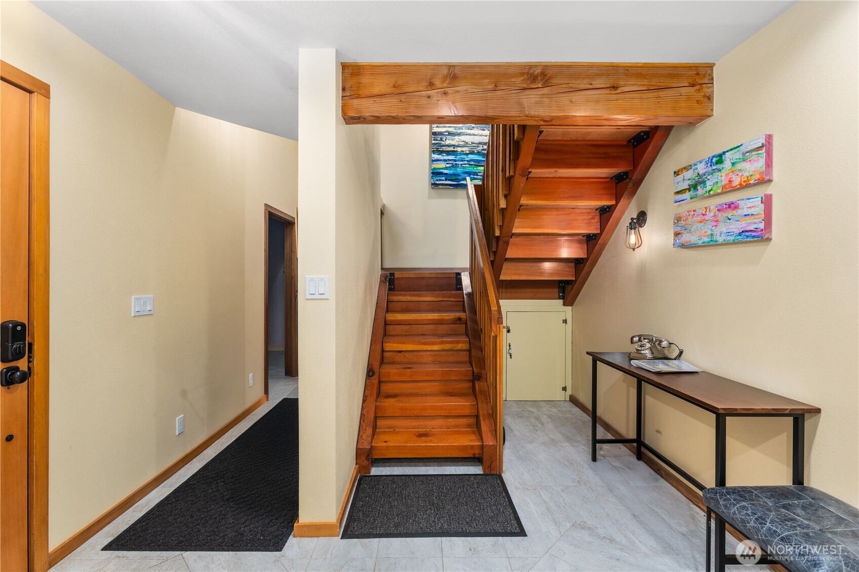 6520 East Mercer Way Mercer Island, WA 98040 - Photo 5 of 36 a view of a hallway with wooden floor and stairs