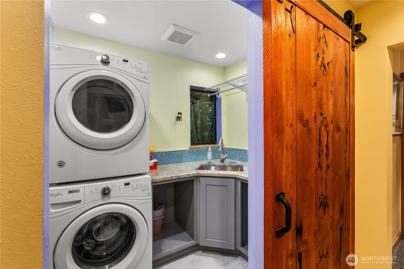 6520 East Mercer Way Mercer Island, WA 98040 - Photo 6 of 36 a view of a hallway with washer and dryer