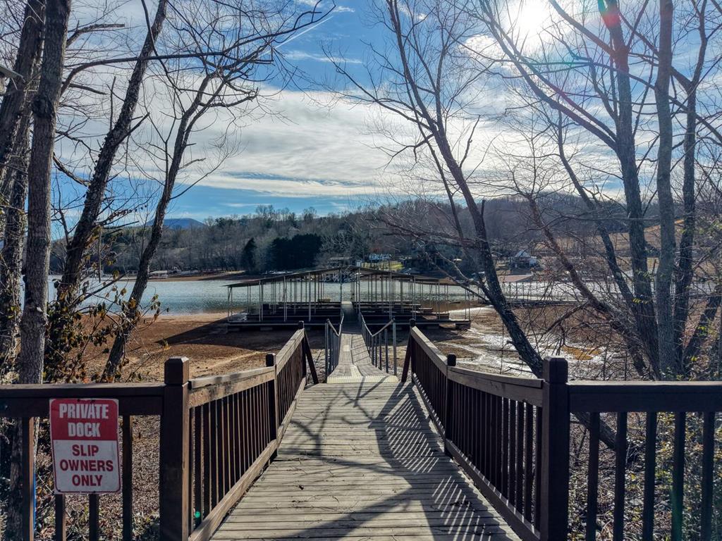 41 Hidden Fields Road Hiawassee, GA 30546 - Photo 16 of 22 a view of a roof deck with wooden fence and floor