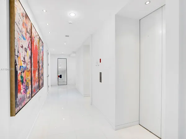 a view of an entryway with a hallway