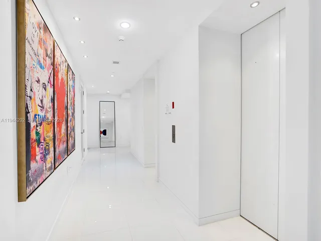 a view of an entryway with a hallway