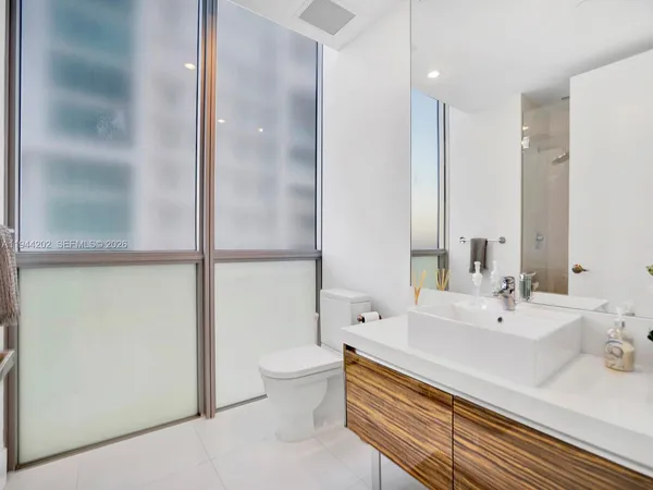 a bathroom with a sink and a large mirror
