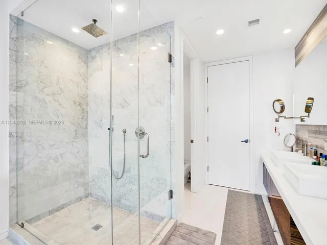 a bathroom with a bathtub and a shower