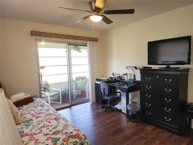 a bedroom with a bed and a a window