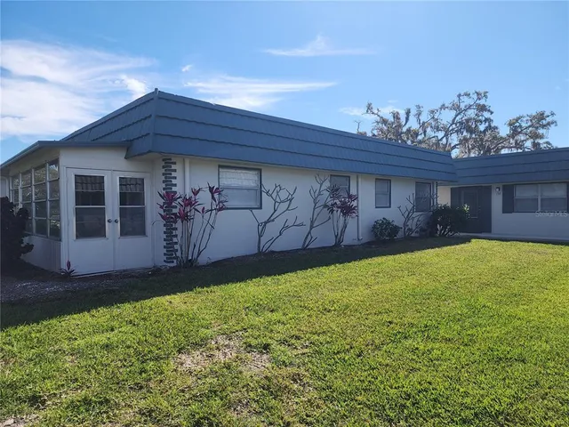 a view of a backyard of the house