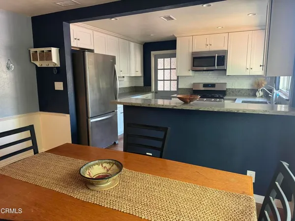 a kitchen with sink and window