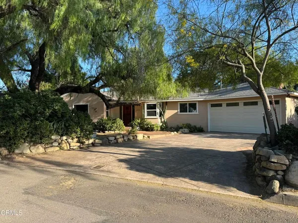 front view of a house with a patio