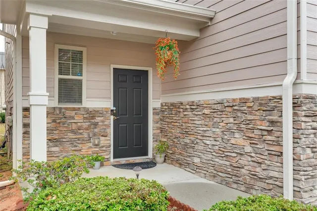 a large kitchen with stainless steel appliances granite countertop a stove a sink and a refrigerator