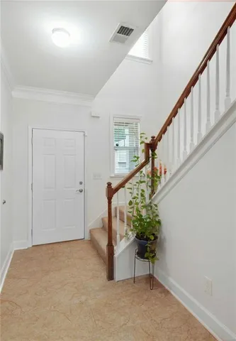 a kitchen with stainless steel appliances granite countertop a refrigerator and a stove