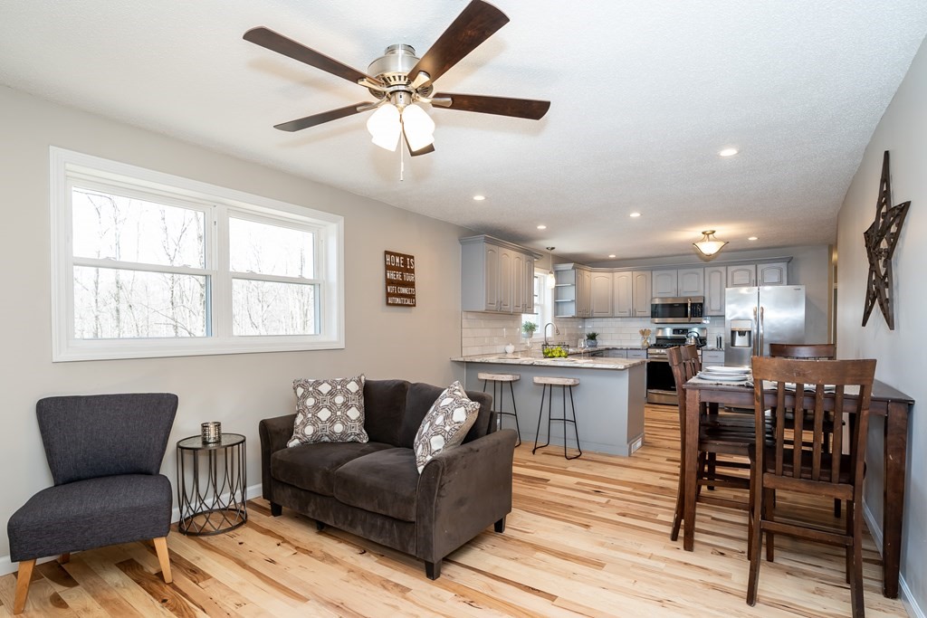 87 McBride Road Wales, MA 01081 - Photo 11 of 36 a living room with stainless steel appliances kitchen island granite countertop furniture and a large window