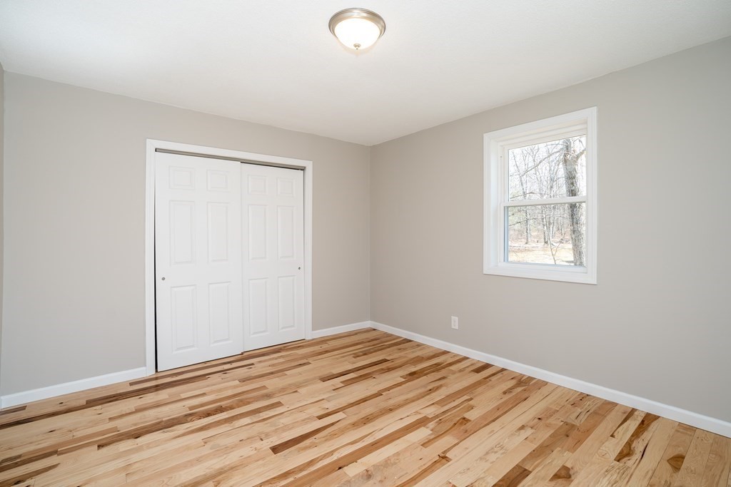87 McBride Road Wales, MA 01081 - Photo 13 of 36 a view of empty room with wooden floor