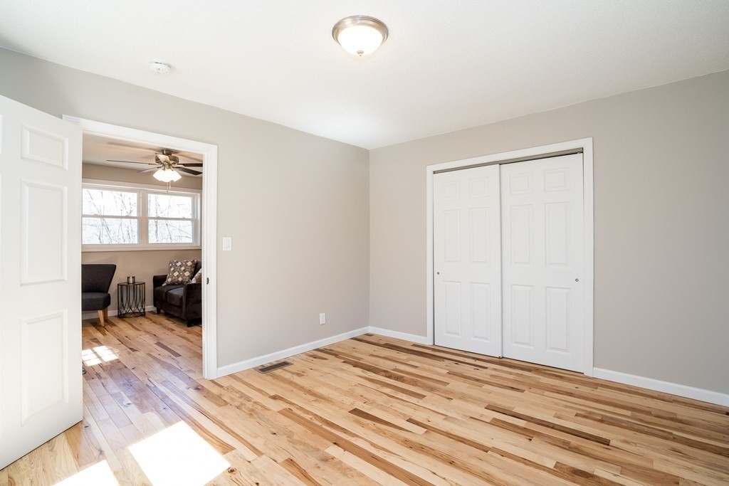 87 McBride Road Wales, MA 01081 - Photo 15 of 36 a view of a bedroom with wooden floor and a bedroom