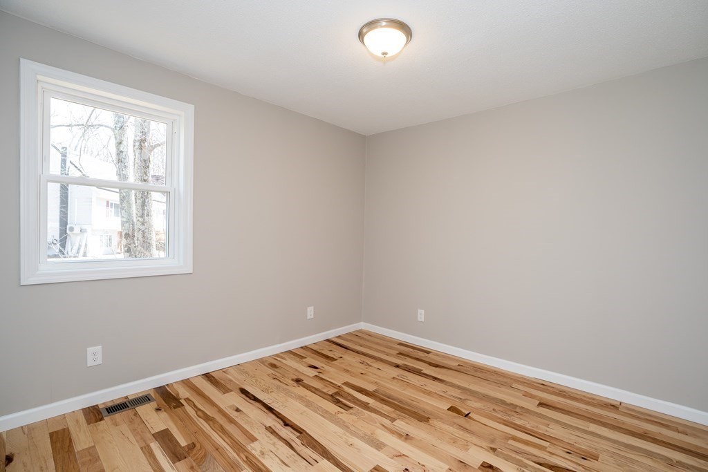 87 McBride Road Wales, MA 01081 - Photo 16 of 36 a view of a room with wooden floor and fan