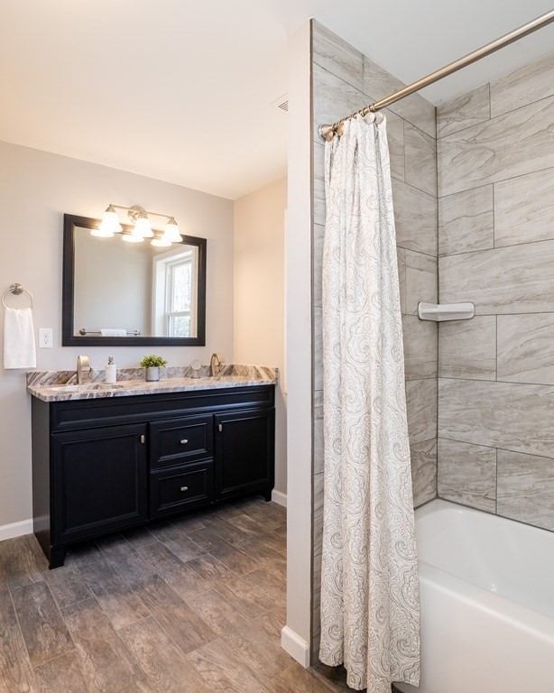 87 McBride Road Wales, MA 01081 - Photo 25 of 36 a bathroom with a granite countertop sink and a mirror