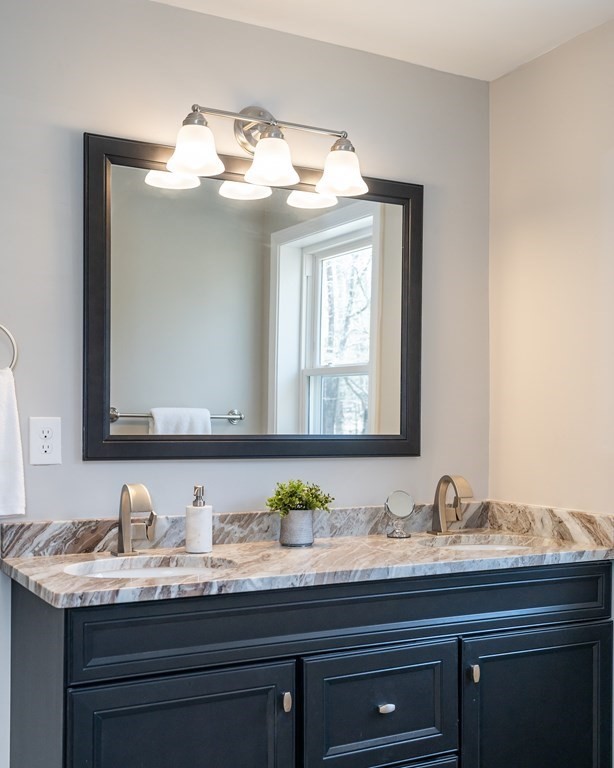 87 McBride Road Wales, MA 01081 - Photo 26 of 36 a bathroom with a granite countertop sink and a mirror