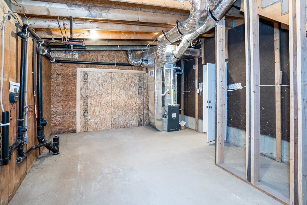 87 McBride Road Wales, MA 01081 - Photo 27 of 36 a view of an empty room with wooden floor