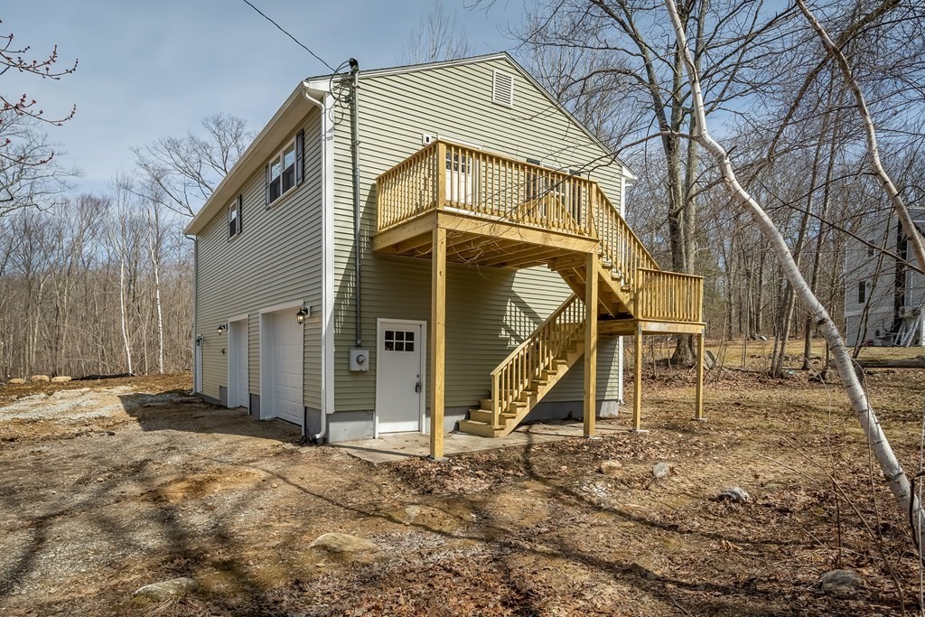 87 McBride Road Wales, MA 01081 - Photo 32 of 36 a view of a house with a wooden fence