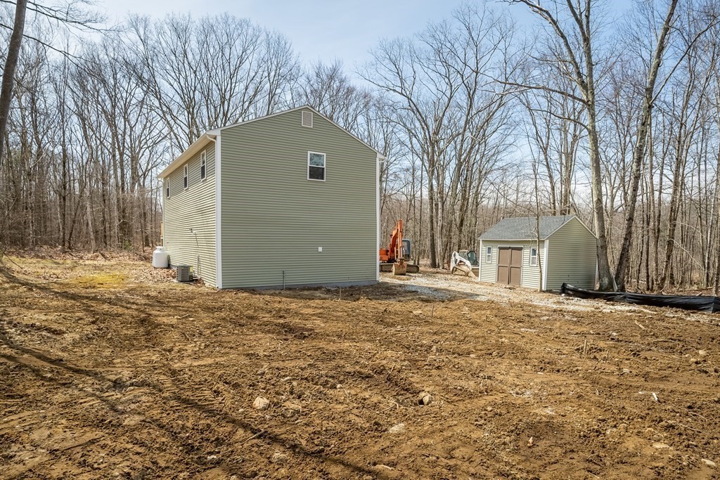 87 McBride Road Wales, MA 01081 - Photo 35 of 36 a house with trees in front of it