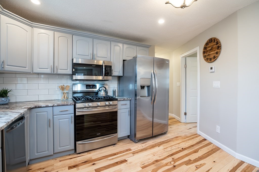 87 McBride Road Wales, MA 01081 - Photo 7 of 36 a kitchen with stainless steel appliances granite countertop a stove a refrigerator and a sink