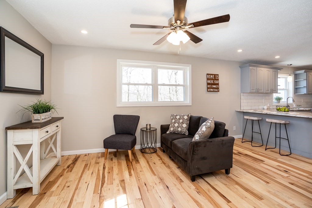 87 McBride Road Wales, MA 01081 - Photo 10 of 36 a living room with furniture and a wooden floor