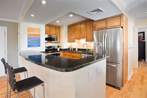 20 Chapel Street, Unit A308 Brookline, MA 02446 - Photo 1 of 5 a kitchen with stainless steel appliances granite countertop a sink a stove and refrigerator