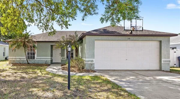 a house that has a tree in front of it