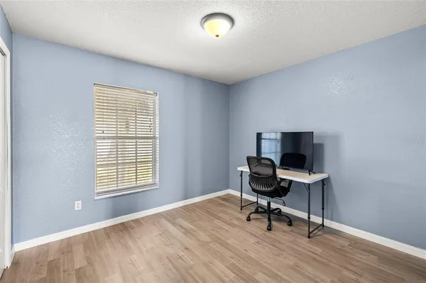 a workspace with furniture and a window
