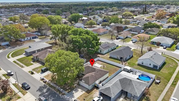 an aerial view of residential houses with outdoor space