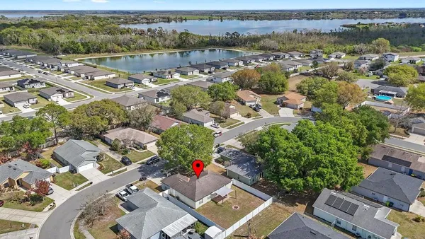 an aerial view of residential house with outdoor space