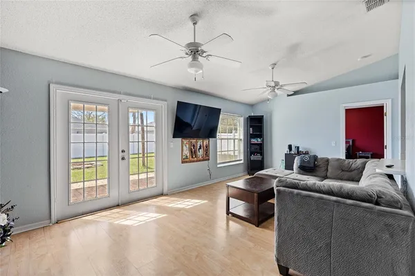 a living room with furniture and a flat screen tv