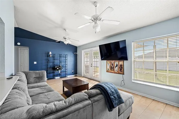 a living room with furniture and a flat screen tv