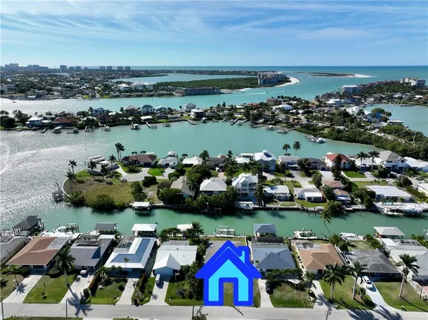 an aerial view of a houses with outdoor space