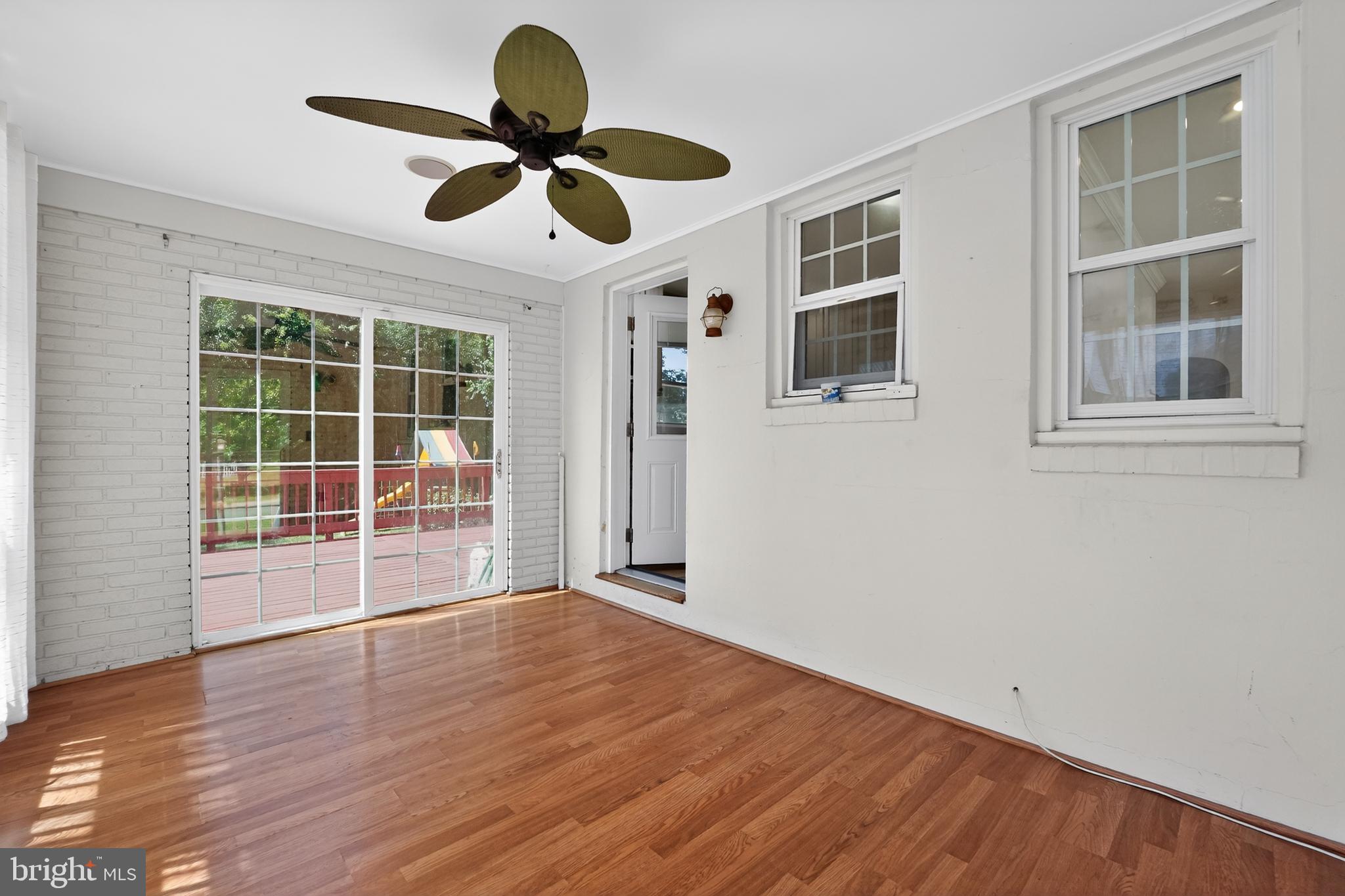 9408 Dana Vista Road Baltimore, MD 21236 - Photo 17 of 38 a view of empty room with wooden floor and fan