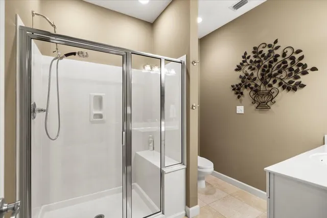 a bathroom with a shower and a mirror