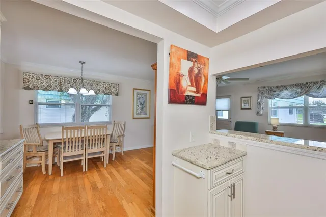 a living room with a sink and a table