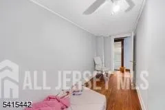 a room with furniture and wooden floor