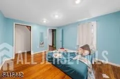 a view of a livingroom with wooden floor