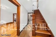 a view of an empty room with glass door