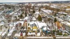 a view of yard covered with snow in front of house