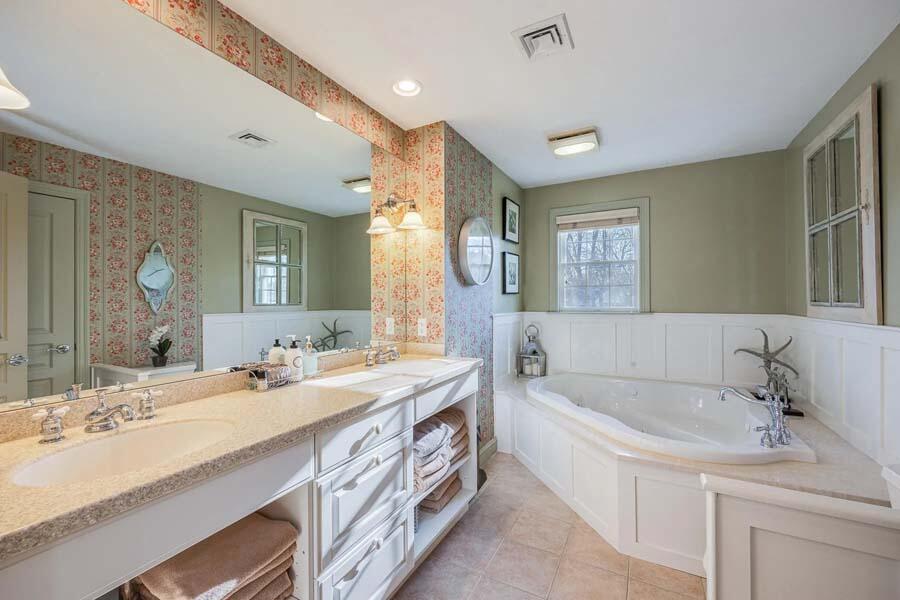 310 Willowbend Drive Mashpee, MA 02649 - Photo 29 of 37 a spacious bathroom with a tub double sink and mirror
