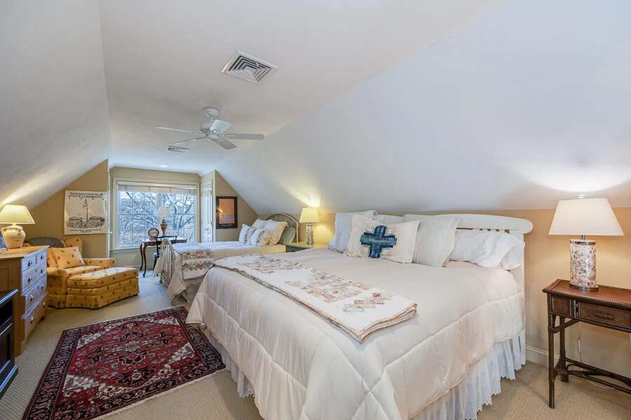 310 Willowbend Drive Mashpee, MA 02649 - Photo 33 of 37 a bedroom with a large bed and a chandelier
