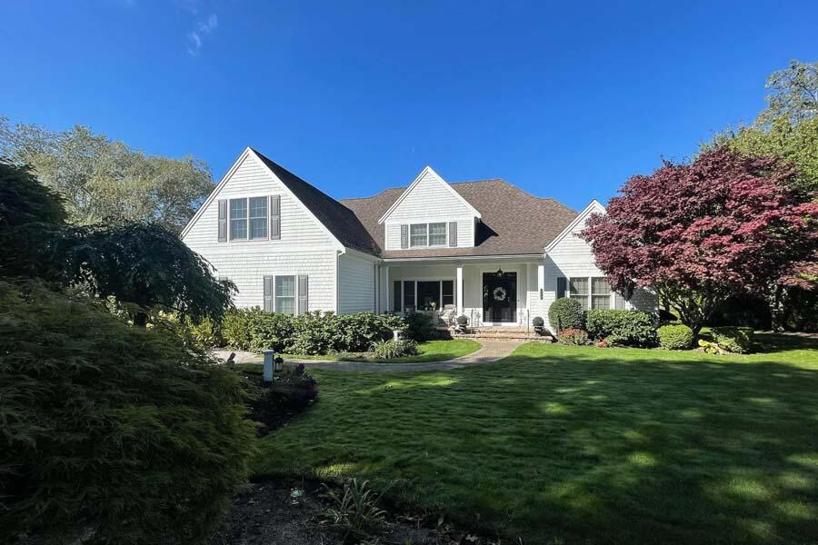 310 Willowbend Drive Mashpee, MA 02649 - Photo 8 of 37 a front view of a house with a garden