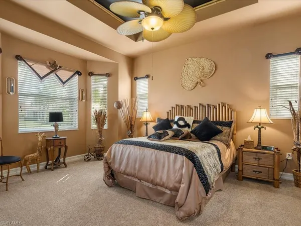 a bedroom with bed and a window