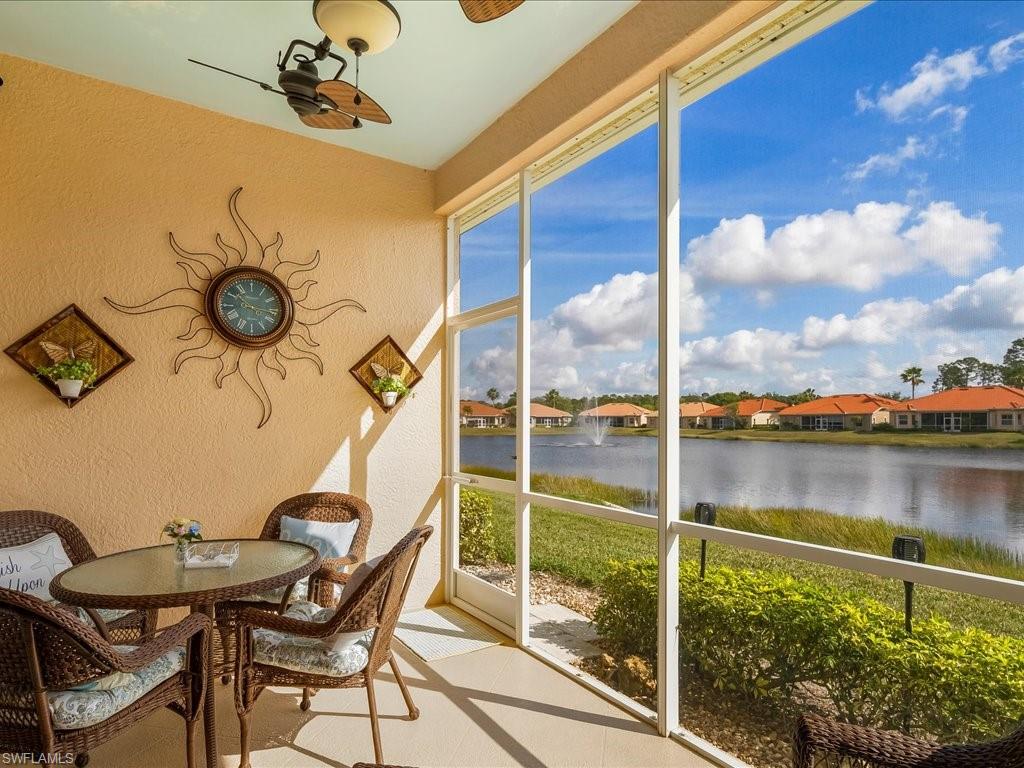 7918 Haven Drive, Unit 2 Naples, FL 34104 - Photo 9 of 30 a view of a balcony dining area and a lake view
