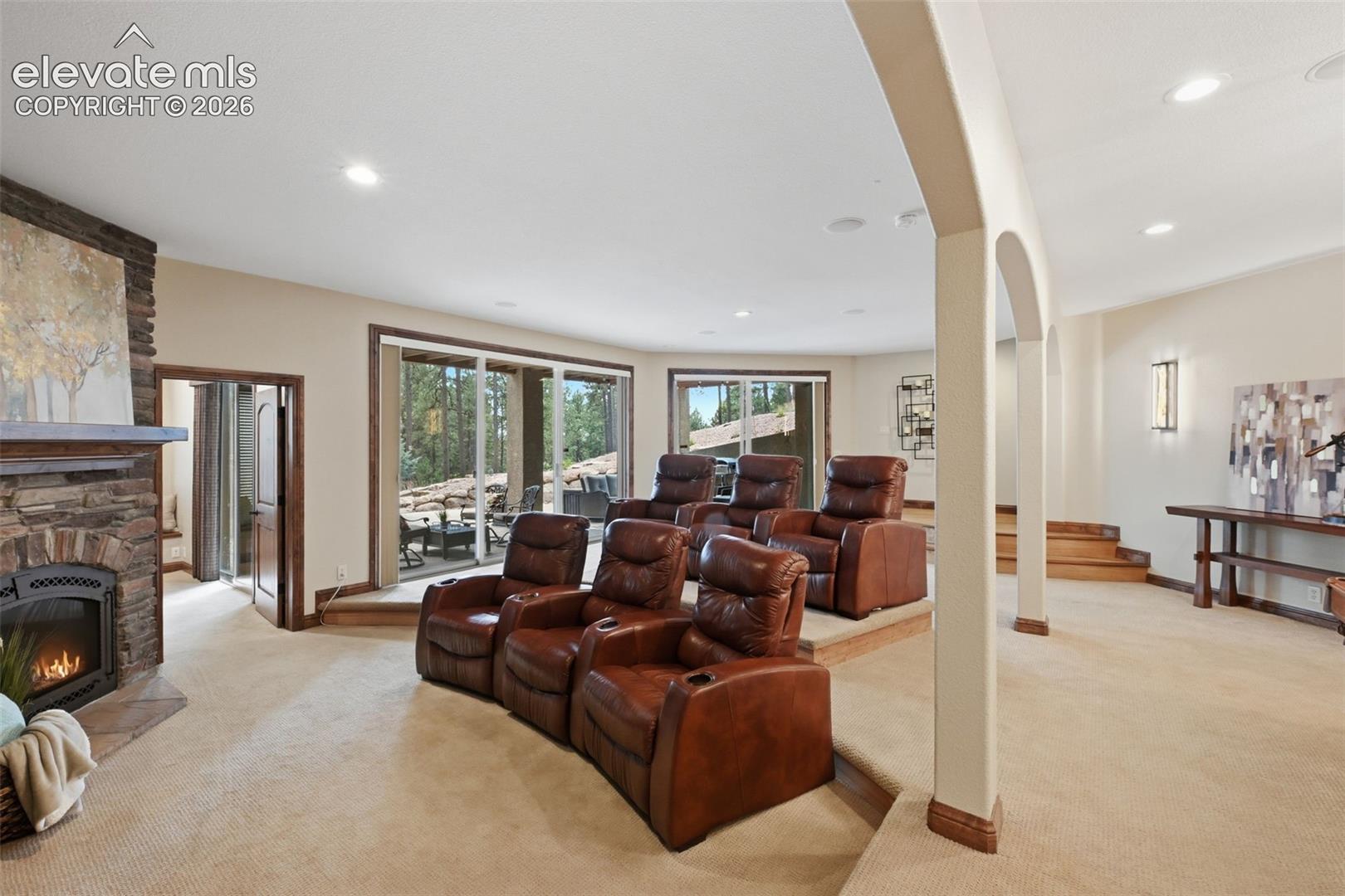 4865 Hidden Rock Road Colorado Springs, CO 80908 - Photo 27 of 50 Walkout basement with media room and third fireplace!