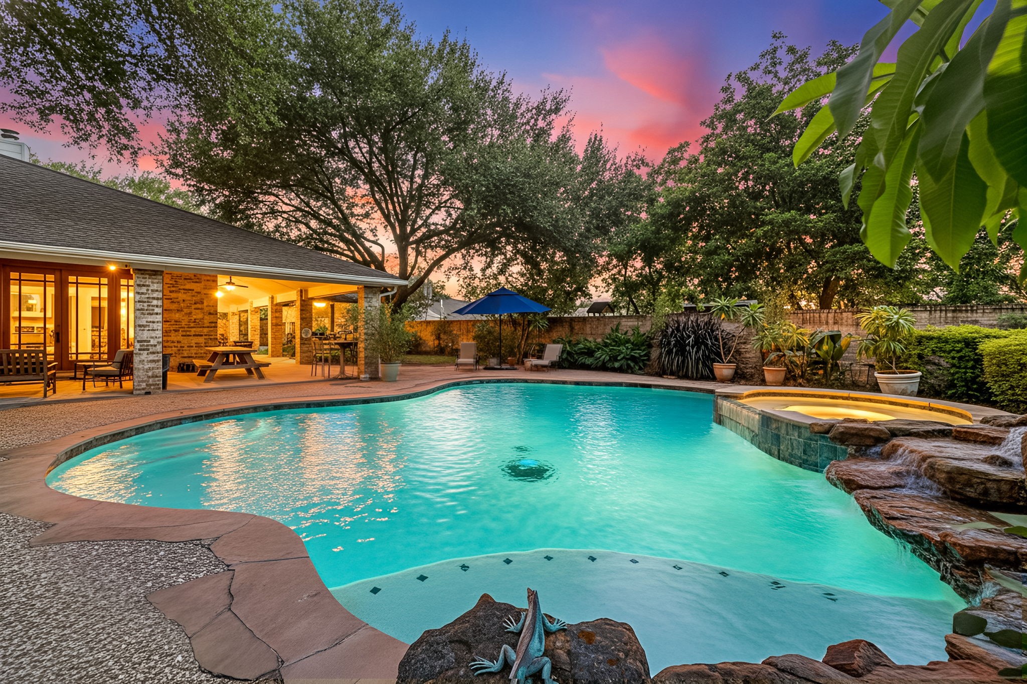 a view of a swimming pool with an outdoor space and seating area
