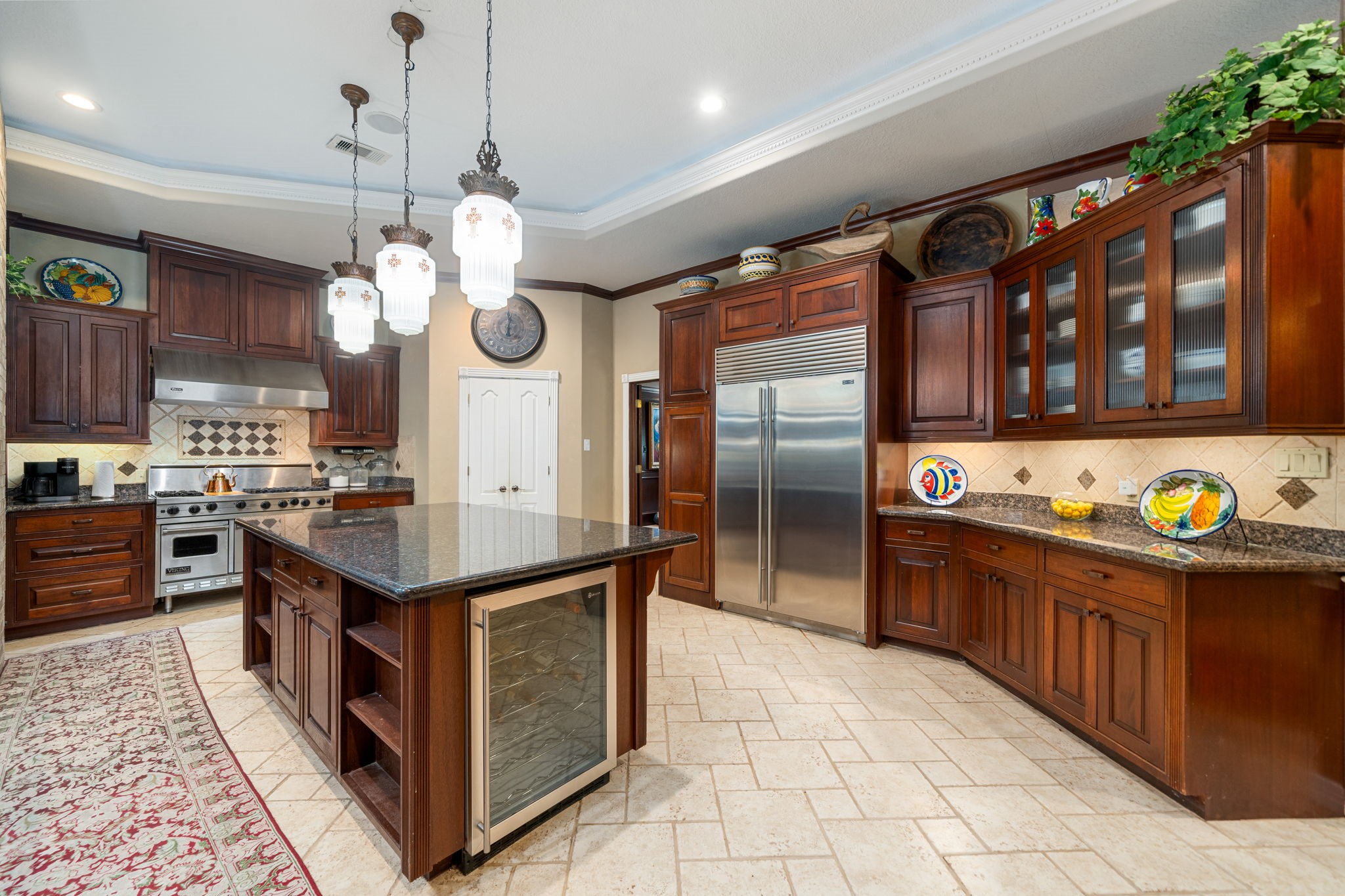 3519 Singleton Road Baytown, TX 77521 - Photo 13 of 46 a kitchen with stainless steel appliances granite countertop a sink a stove and a refrigerator