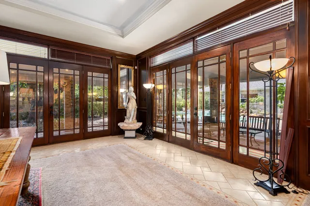 a spacious bedroom with a large bed and a large window